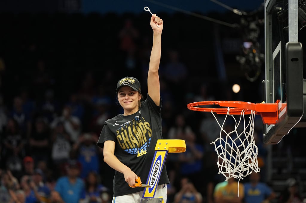 UCLA guard Gabriela Jaquez (11) cuts down a piece of the net after UCLA defeated South Carolina in the women's National Championship Final Four NCAA college basketball tournament game, Sunday, April 5, 2026, in Phoenix. (AP Photo/Rick Scuteri)