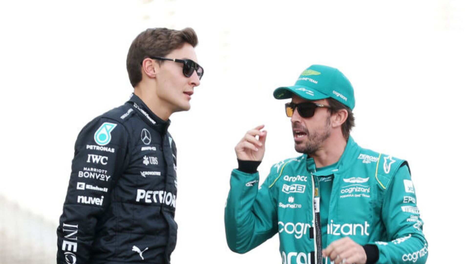 George Russell y Fernando Alonso