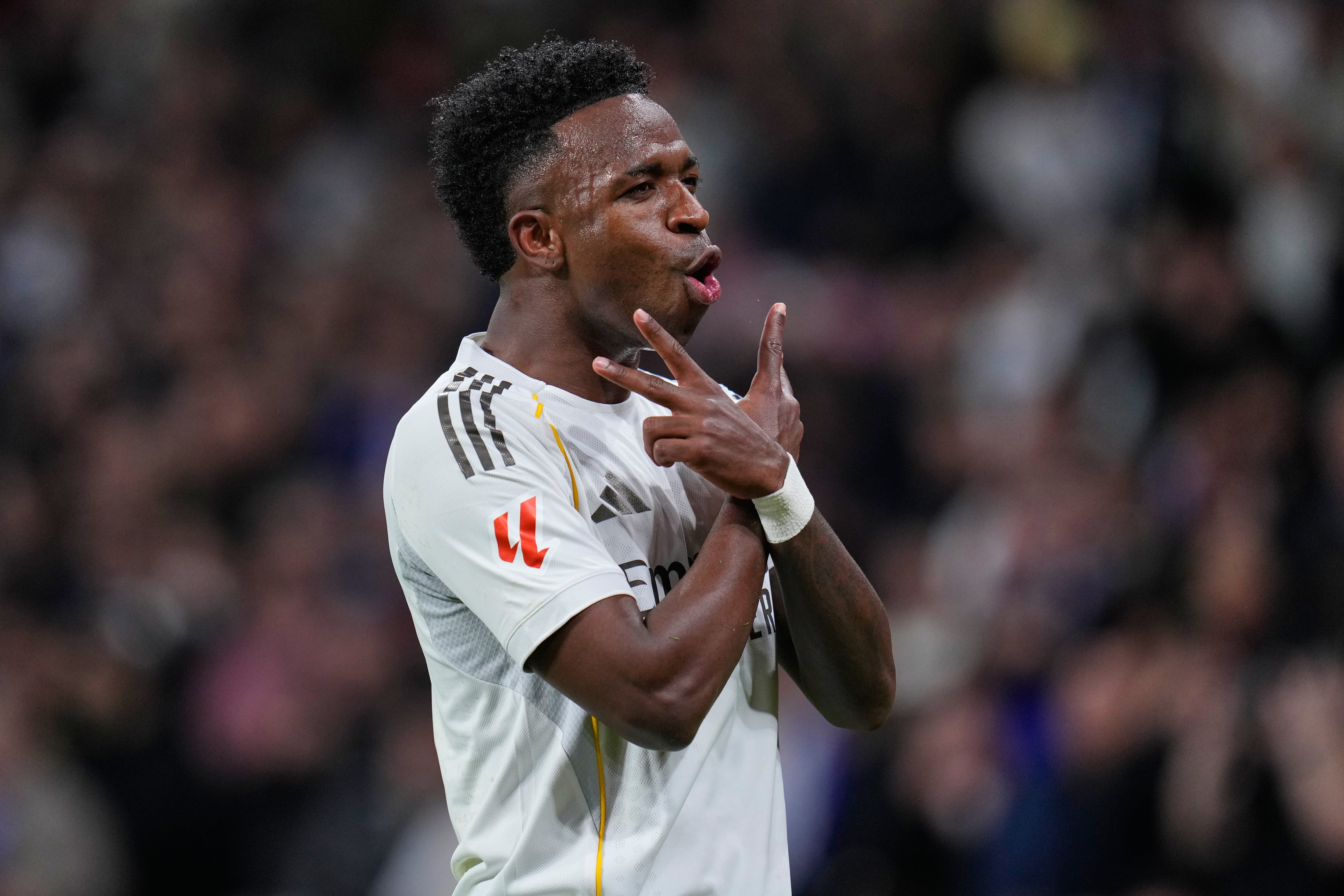 Real Madrid's Vinicius Junior celebrates scoring his side's 2nd goal from the penalty spot during the Spanish La Liga soccer match between Real Madrid and Real Sociedad in Madrid, Spain, Saturday, Feb. 14, 2026. (AP Photo/Manu Fernandez)