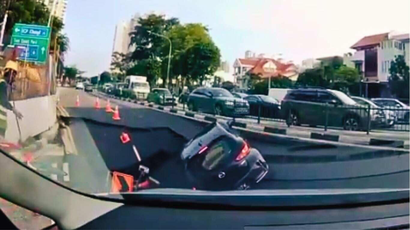 Socavón se traga a conductora en Singapur