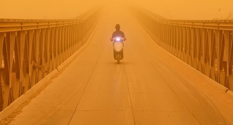 A powerful sandstorm covers the streets of Iraq.