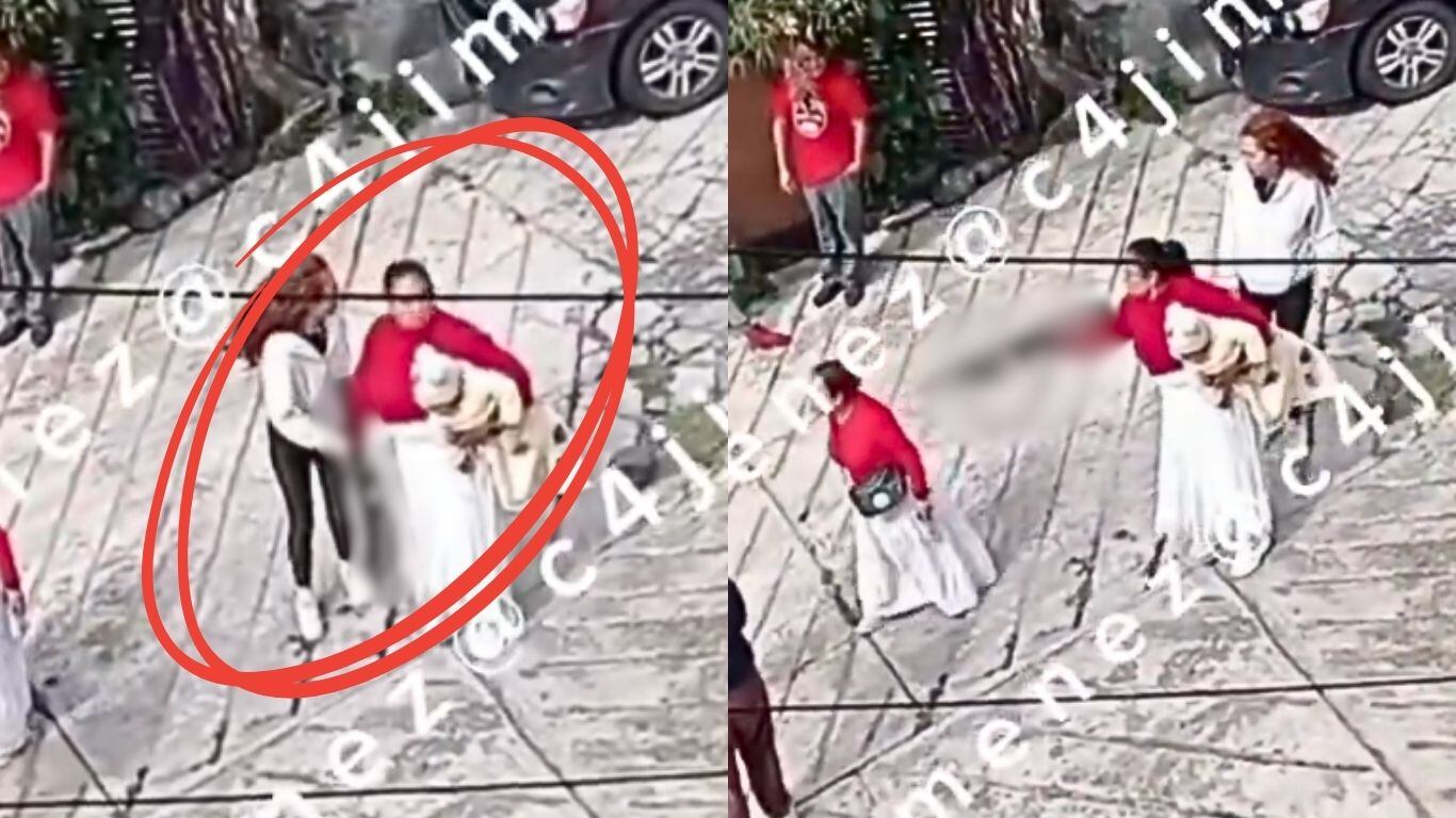 Saca rifle con su bebé en brazos