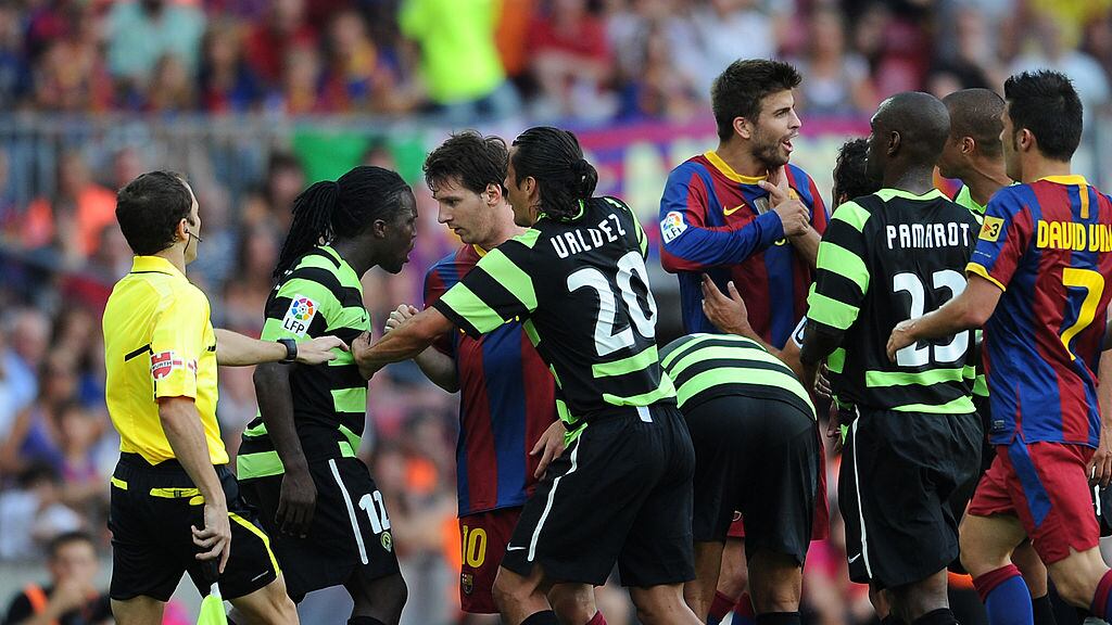 Royston Drenthe y Lionel Messi